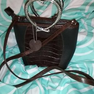 Bucket style medium brown leather crossbody purse bag